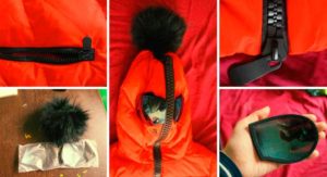 Пухеното яке се закопчава с всички ципове и нитове.