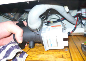 Removing the drain hose from the washing machine