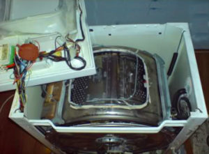 Disassembling a top-loading washing machine