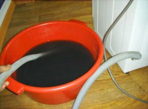 Drain the water from the washing machine using the drain hose