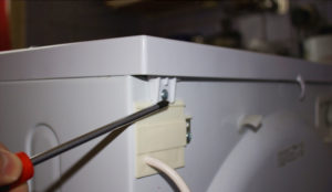 Remove the top cover of the washing machine